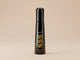 Black eau de perfume spray bottle with yellow 555 label and glossy cap.